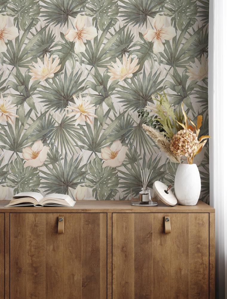 Tropical-style wallpaper with large green palm leaves and soft peach flowers, paired with a wooden cabinet decorated with a white vase of dried flowers and a fragrance diffuser.