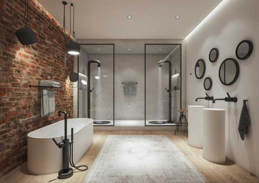 Moodne vannituba, kus tellissein ja matt mustad detailid loovad stiilse kontrasti. Vabas seisev vann, dušinurgad ja kõrged valamud rõhutavad minimalistlikku joont.