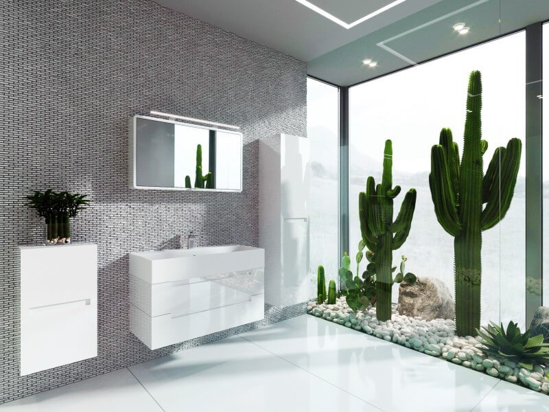 Valge l&auml;ikiv vannitoam&ouml;&ouml;bel modernses interj&ouml;&ouml;ris, mille aktsendiks on kaktustega klaassein. Sisaldab madalat ja k&otilde;rget seinakappi, peeglit ja sahtlitega valamukappi.